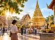 Conceptual AI illustration of visitors offering flowers at a Buddhist temple in Thailand, representing religious holidays and local traditions