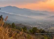 Smoky, hazy mountain valley in northern Thailand during a dry-season sunset.