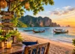 Beach bar table and wooden signpost at sunset on a Phuket beach with longtail boats and limestone cliffs. AI-generated image.